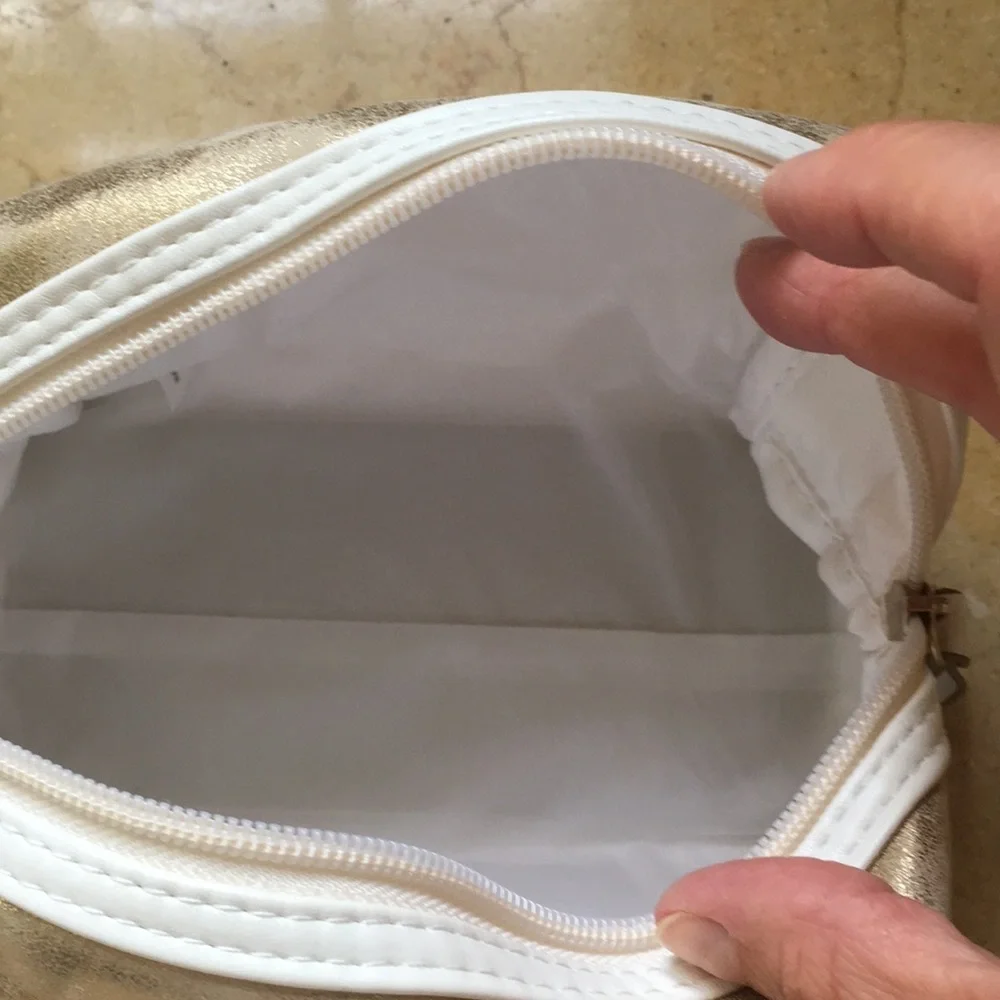 Gold distressed Orlane Paris makeup/cosmetic bag